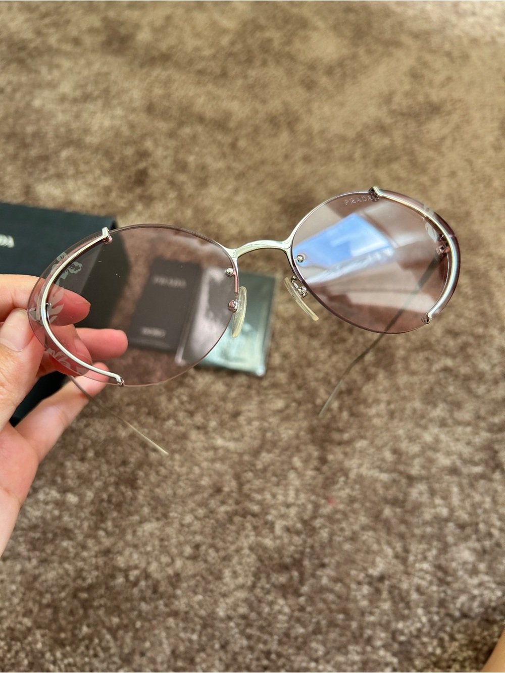 Prada Women's Round Silver Frame Sunglasses with Brown Lenses